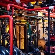 A large amount of pipes, ductwork, etc. representing the differences in heat pumps and traditional HVAC units alternatives.